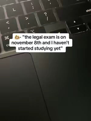 The image shows a close-up of a laptop keyboard, with focus on the letter keys and the trackpad area. On top of the keyboard, a white rectangular box contains text revealing an upcoming legal exam date, with a person's intention of not having started studying yet.