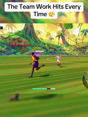 A stylized, animated scene from a video game. A person in a yellow shirt and purple shorts is running on a green field, towards a soccer ball. Two other players, one also running and another standing in the distance, are in the scene. The background consists of animated tree-like structures and a vibrant sky.