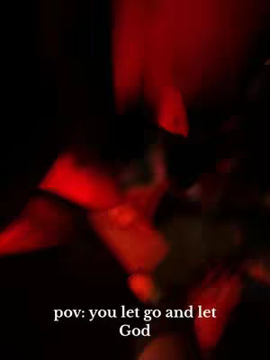 A dark, blurry image with shades of red and black. The overall impression is abstract and atmospheric. The primary color is red, which appears as a bright, blurred glow, possibly from a light source, against the darker background. There is a hint of motion or movement. The layout is indistinct, with no clear focal point, giving it a sense of depth and mystery.