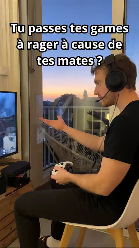 A man in a gaming setup is sitting in front of a window, gesturing towards the game screen with a headset on. Overlay text asks if you get angry at your teammates in games.