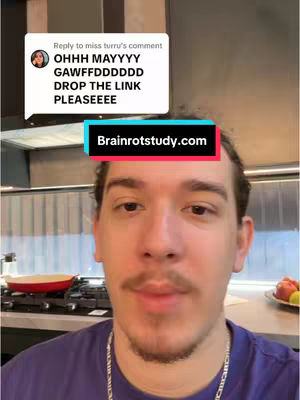 The cover image features a young man, centered in the frame, looking directly at the camera. He has medium-length, dark hair and a mustache, and is wearing a purple t-shirt. Behind him is a kitchen setting, with a stovetop and a red pan visible. Text overlays are placed at the top and near his forehead with comments and the website name.