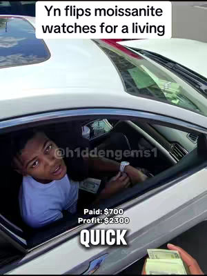 A young man is sitting in the driver's seat of a white car. The image is shot from a low angle, looking up towards the windshield. Text overlays describing the subject matter and financials of a business venture are added at the top and bottom of the screen.