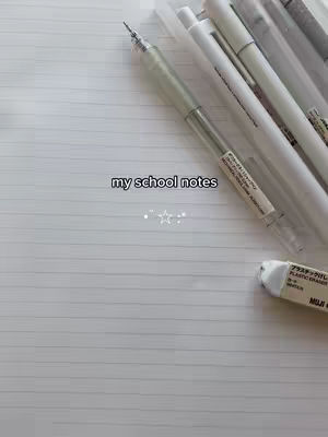 The cover image shows a close-up shot of stationary items on a white, lined paper. Several pens, pencils, and an eraser are visible, suggesting a focus on note-taking or studying. The layout is simple, with neutral tones and textures.