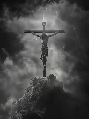 A black and white image depicting Jesus Christ on the cross atop a rocky hill, with dark, stormy clouds and bolts of lightning in the background. The overall composition is dramatic and evokes a sense of solemnity.