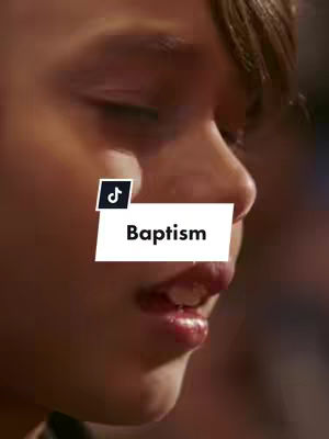 The image shows a close-up of a person’s face. The focus is on the profile, lips, and part of an eye. The TikTok logo appears in the upper-left, and a white rectangular sticker with the word "Baptism" in black text overlaying the person's lips.