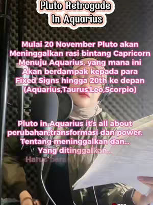 A woman with fair skin and light-colored hair is the central focus, positioned against a dark background that has acoustic foam. She is wearing a hijab, and is holding a microphone. The image is overlaid with text information in a pink font. The layout is designed for a portrait-style video with the intent to offer guidance or information about astrological events.