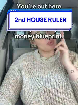 The image shows a woman in a car with text overlays. She has short hair, glasses, and is wearing a sweater. The main text overlay is in a white box with a blue top bar, displaying the text "2nd HOUSE RULER". Above that, the text "You're out here" is visible