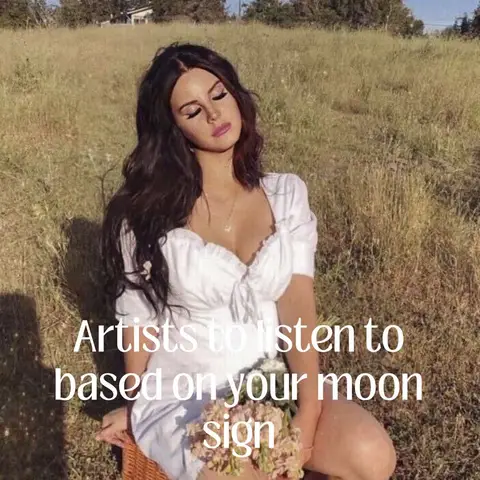 A woman with long dark hair and a white dress sits in a field of tall grass with her eyes closed. Text overlay indicates the video is about artists to listen to based on moon signs.