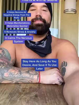 A shirtless man with tattoos on his arms is seated at a table. Text overlays explain the benefits of a 417Hz sound. The man has a goatee, and a bandana.