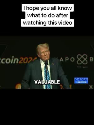 The image shows Donald Trump speaking at a podium. Above him is a text overlay, and there are logos in the background.