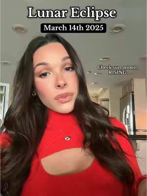A woman with long dark hair and red top is centered in the frame against a blurred interior background and text overlays.