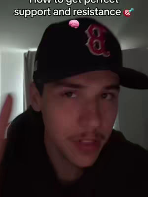 A selfie-style video cover image showing a young man in a black baseball cap and hoodie. The cap is black with a red 'B' logo. The man is looking at the camera, with text at the top. A pink brain emoji and bullseye is above the cap.