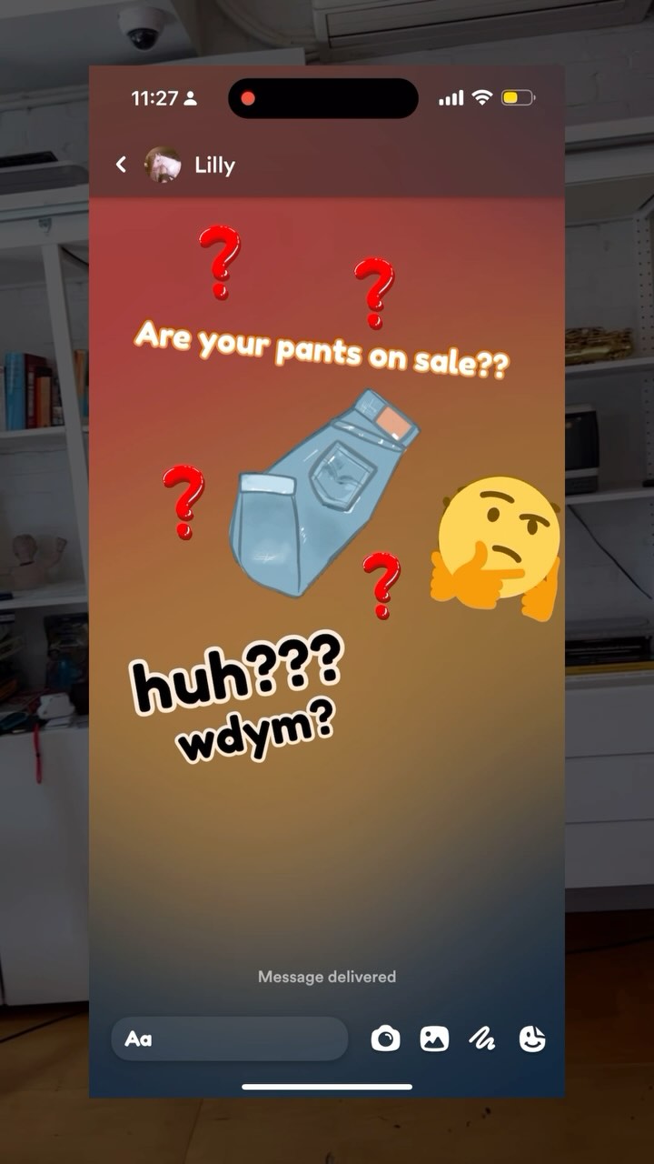 The image captures a smartphone screen displaying an animated chat interface. At the top, a red gradient fades into a darker orange. On the screen, a chat conversation unfolds with stylized text and emojis. The central message in large, bold text asks, "Are your pants on sale??" surrounded by cartoon question marks and an illustration of jeans. Below, the response reads "huh??? wdym?"  A thinking face emoji is on the right side. The background inside the chat bubble fades from lighter orange to a darker tone. The bottom shows input fields and icons common in chat applications.