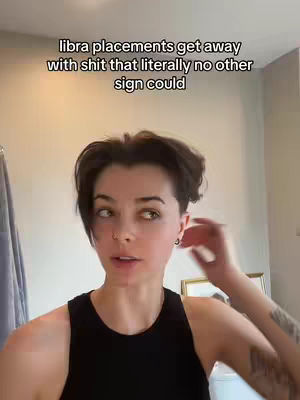A woman is in front of a camera in a bathroom mirror. Text overlays the image.