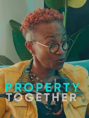 The cover image features a woman with short, orange-tinted hair and glasses in a close-up shot. She's wearing a yellow jacket over a patterned top, and a microphone is positioned in front of her. Overlayed on the image is teal text that reads "PROPERTY TOGETHER". The background includes blurred green elements, suggesting a studio or interior setting.