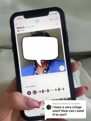 A close-up shot of a smartphone displaying a dating app profile on the screen. A person's hand, with painted nails holding the phone, is visible at the bottom of the screen. A white speech bubble is covering the face in the profile picture. A comment overlaid on the screenshot.