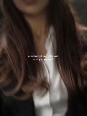 The cover image is a blurred shot featuring a woman's upper body. Her brown hair is the most prominent element, with strands cascading down, partially obscuring her face. She wears a white shirt under a black blazer. Subtle text is overlaid, indicating the video's theme.
