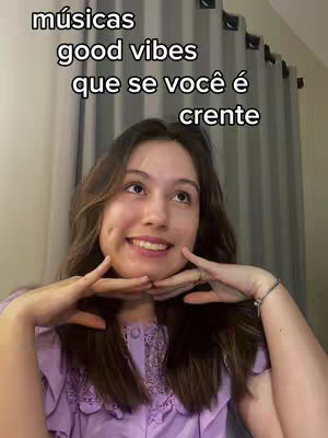A young woman with brown hair and a purple top is smiling. She is holding her hands near her face, creating a frame with her fingers, with text overlayed at the top.