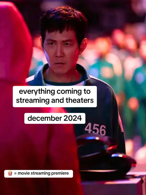 The cover image features a scene from a show. In the foreground, a person in a red outfit seems to be addressing the main character. The main character, an Asian man with dark hair, has a concerned expression, looking directly at the viewer. Behind him, several people in green tracksuits with numbers are slightly blurred. The top of the image has the text overlayed:   "everything coming to streaming and theaters", followed by "december 2024".