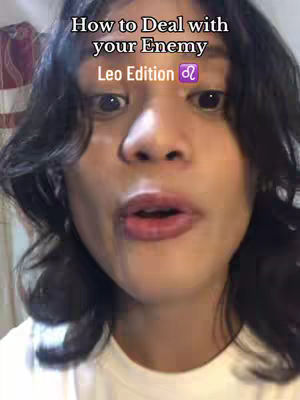 A close-up shot features a person with dark, wavy hair looking directly at the camera with a slightly open mouth, as if speaking. The upper portion of their cheeks and forehead fills most of the frame, with the top of a white shirt visible at the bottom. Text overlays at the top explain the video's subject.