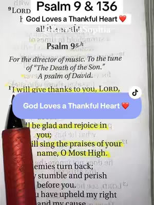The image shows an open Bible with highlighted text, a pen, and text overlays. The page is open to Psalm 9 and 136. A red pen is in the bottom left corner. A text overlay reads, 'God Loves a Thankful Heart' with a heart emoji. The background is a book. 