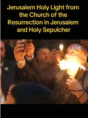 The cover image shows a vertical video of a public event. In a dark environment, multiple people are holding candles aloft. The faces of the individuals are brightly lit by the flames, and the word 'LIVE' appears in red at the top right corner. The text overlay reads 'Jerusalem Holy Light from the Church of the Resurrection in Jerusalem and Holy Sepulcher'.