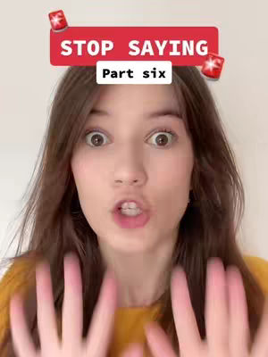 A young woman is in the focus, with an open mouth and wide eyes, looking directly at the camera. Above her is a red banner with text, and on the left and right sides of the banner are small red stars. She is wearing an orange shirt, and the background is a simple white wall.