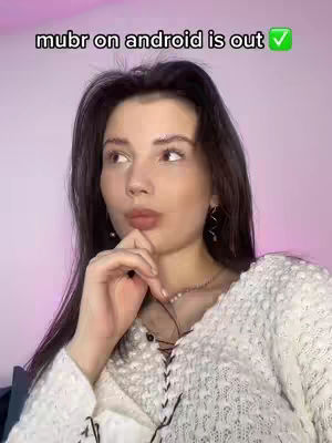 A woman with dark hair and a white sweater looks thoughtful, with text overlayed at the top.