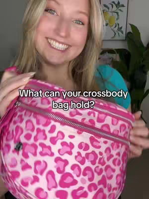 A smiling woman holding a bright pink patterned bag, with text overlayed.