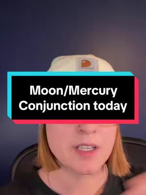 A woman with short blonde hair is centered in the frame, wearing a white Carhartt branded bucket hat and a black shirt. A text overlay across the top of the image in a red and blue box states "Moon/Mercury Conjunction today". The background is a navy blue gradient.