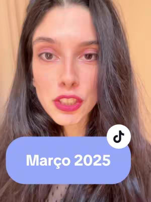 A woman with long dark hair looks directly at the camera. She has pink eyeshadow and bold pink lipstick. A light blue rounded rectangle at the bottom of the frame has the text "Março 2025" in white. A white TikTok logo is in the upper right corner.