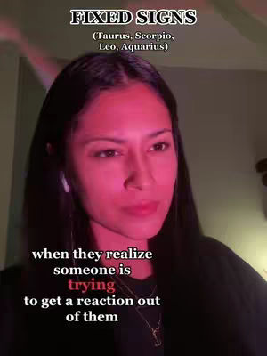 A woman with dark hair and fair skin appears on the cover image, set against a somewhat dimly lit background that gives the impression of an interior setting. Above her are some white text layers. The woman's pose is oriented towards the camera, and she's wearing small white earbuds. The image is framed for a vertical video format.