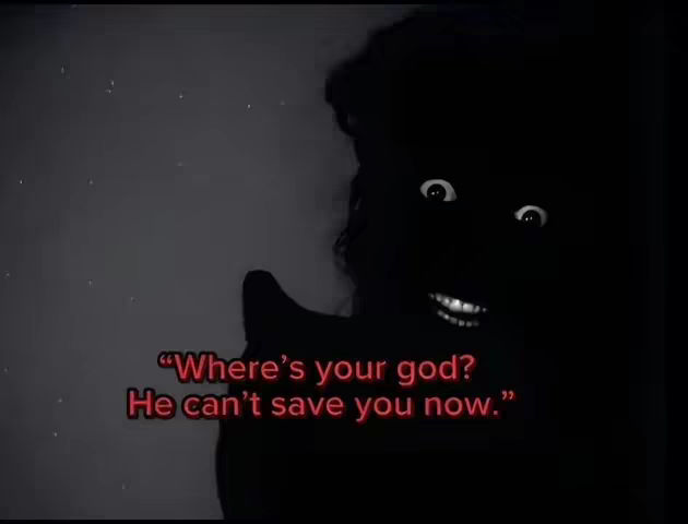 A black and white image with a dark background. A silhouetted figure with visible eyes and a mouth is in the foreground. The text overlayed in red reads: “Where’s your god? He can’t save you now.”