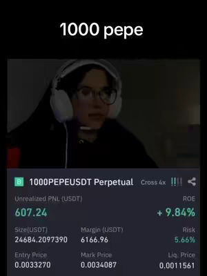 A person wearing glasses and headphones is looking at the screen. On the screen, there is a cryptocurrency trading interface showing gains on a PEPE perpetual contract.