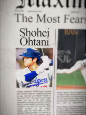 A newspaper-style layout features a central image of Shohei Ohtani in a baseball uniform, set against a blurred background. The main image is in a rectangular space, and the overall layout uses a grayscale color scheme with a vintage feel. Text elements include headlines and other article text around the image.