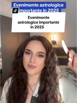 A woman with long, wavy brown hair looks directly at the camera, smiling slightly. She wears a white top. Behind her is a room with a bed and a wall with a decorative element. The top of the image has text in a blue box that reads 'Evenimente astrologice importante în 2025'. Below it, on the bottom left, is a TikTok logo.