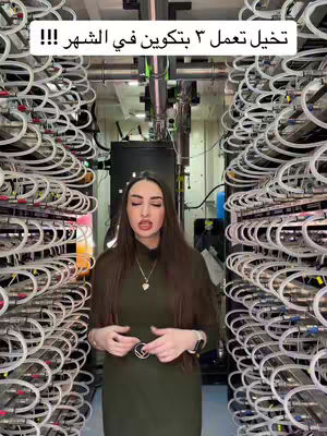 A woman stands in front of rows of servers in a data center. She is wearing a green dress and a necklace, and the background is filled with the orderly arrangement of the servers.