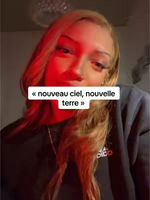 The cover image features a woman with long blonde hair, her face partially obscured by red lighting. A text overlay in a white box reads "« nouveau ciel, nouvelle terre »". She is wearing a black sweatshirt, and the overall composition is a close-up shot focusing on her face.