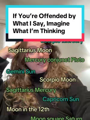 A selfie-style video cover image features a woman with long, wavy hair and glasses against a neutral background. Above her head is a rectangular text overlay in bold white font on a light blue background with a red border. The woman has various astrological terms and symbols written in green and yellow. The overall composition is focused, with a casual, informal feel.