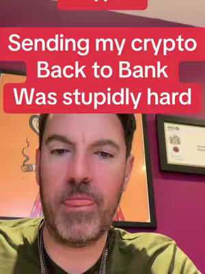 The cover image is a selfie-style shot featuring a man against a backdrop. Above his head is a red bar with white text. He is wearing a green T-shirt and a silver chain. In the background, there's a framed piece of art on the left and a certificate or framed paper document on the right behind the man.