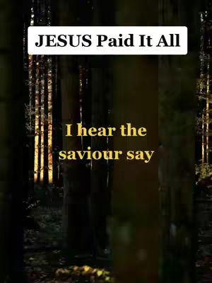 The image features a dark forest scene with trees in the foreground and sunlight filtering through the trees in the background. Text overlays are present, with a white rectangular banner at the top that reads 'JESUS Paid It All', accompanied by a lower key text 'I hear the saviour say' in yellow.