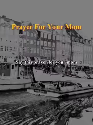 Black and white photo of a narrow waterway with several boats docked along the banks of buildings. Text overlays indicate the video content is about prayers, specifically a prayer for one's mother.
