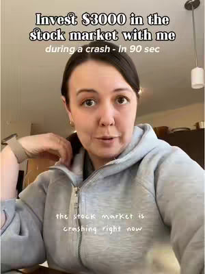 A woman in a gray hoodie looks directly at the camera, with text overlays describing investing during a stock market crash, shot from the chest up. The background appears to be a home interior.