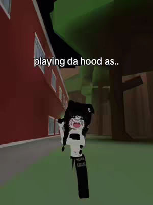 An avatar from a Roblox game is featured, rendered in a cartoonish style with a black and white outfit, standing in front of a red brick building. The text overlay reads, "playing da hood as.."