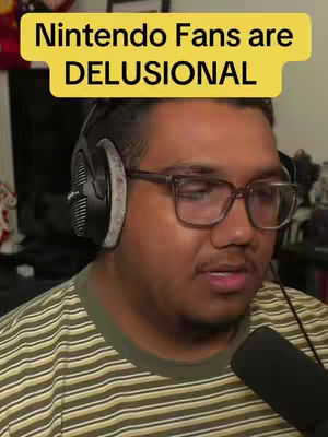 A man with glasses and headphones is looking towards the right, the image is overlaid with a yellow banner reading "Nintendo Fans are DELUSIONAL".
