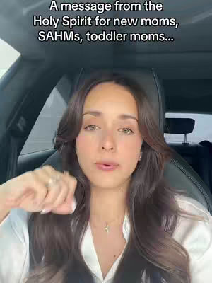 A woman with long brown hair is seated in a car. Text overlayed at the top of the image.