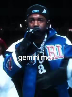 The cover image shows a man with dark skin holding a microphone close to his mouth. He is wearing a backward black cap, earrings, a blue jacket, and a silver chain. Text overlayed on the image says 'gemini men'. The background is dark, placing focus on the man.