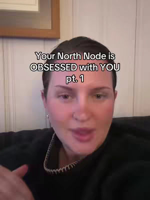 A person with short dark hair and a black top looks towards the camera. Text overlayed on image.