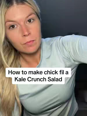 The cover image shows a woman with long blonde hair looking towards the camera. The top part of her body is visible, she's wearing a light blue top. The background is dark. Centered at the bottom is a white bar with black text.