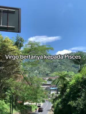The image shows a scenic outdoor view featuring a road winding through lush green hills and trees under a bright blue sky. Text overlays mention the zodiac signs Virgo and Pisces.